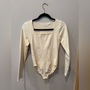 Elegant Cream Long Sleeve Bodysuit